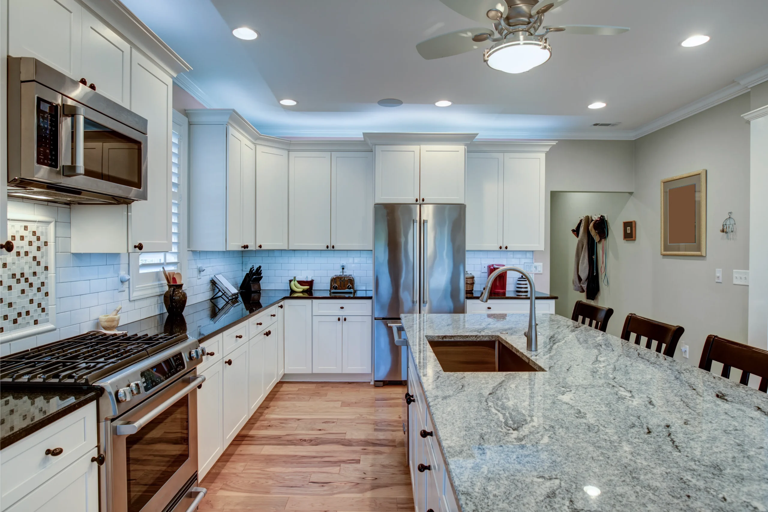 Transitional kitchen with shaker cabinetry in Virginia by FT Remodeling